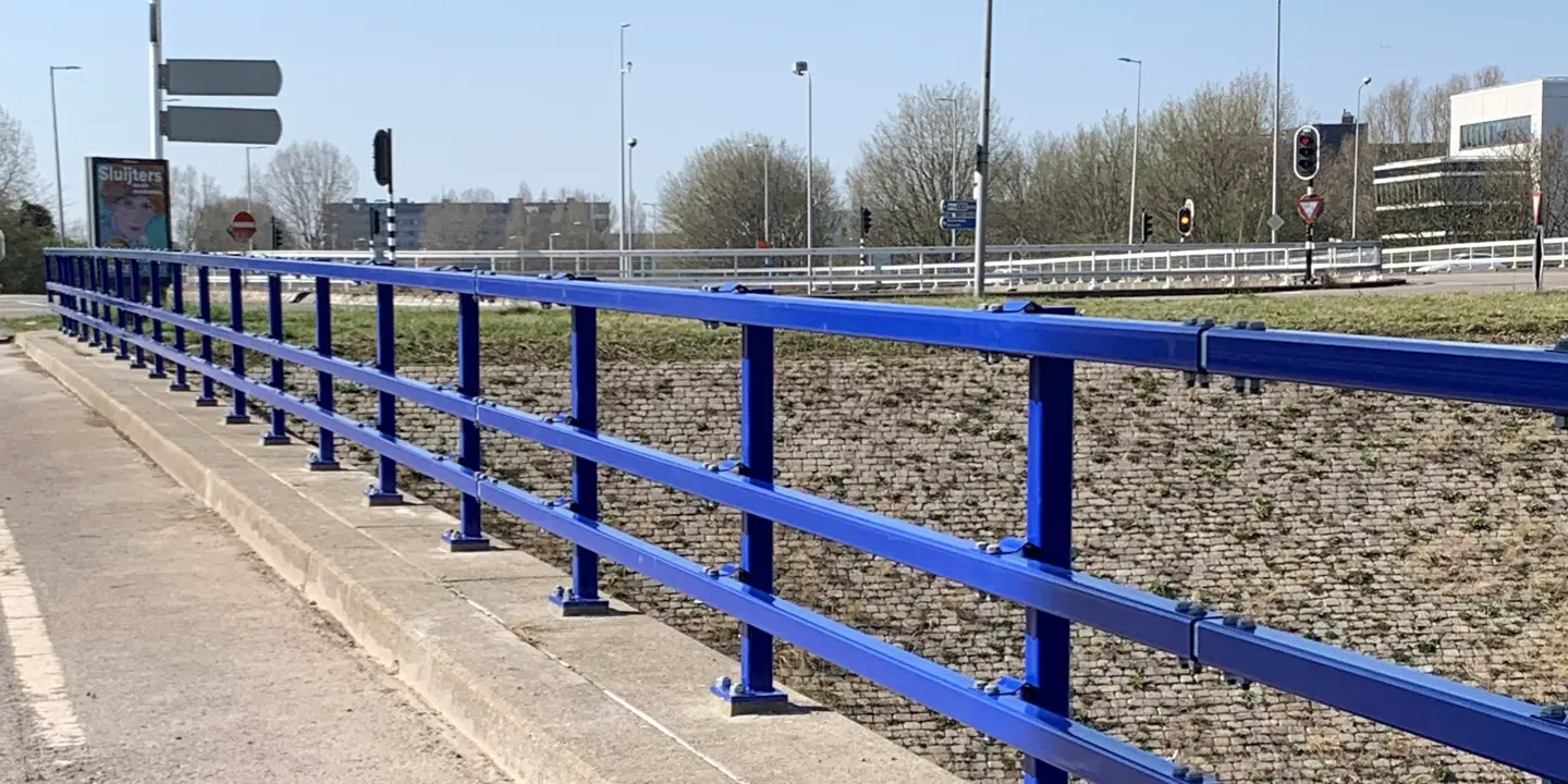 blue parapet on the edge of a viaduct